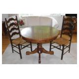 Oak pedestal dining table w/ one leaf, 40" diam. -