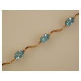 14K yellow gold & blue Topaz 7' tennis bracelet,