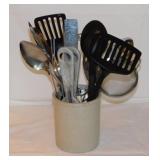 Crock full of kitchen utensils