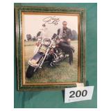 Harry Gant autographed 8x10 sitting on Harley