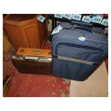 Navy suitcase w/ extension handle & wheels - two