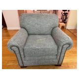 Ashley Gaelon Dune Chair with Blue Throw Pillow.