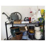 Top 2 Shelves of Planters and Garden Supplies