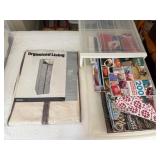 2 Bins Containing Fabric and Books about