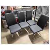Four Black Upholstered Cantilever Dining Chairs