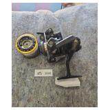 Black Fishing Spinning Reel with Gold Spool