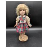 Porcelain Doll with Plaid Dress on Stand