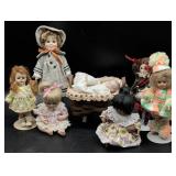 Seven Porcelain and Vinyl Dolls