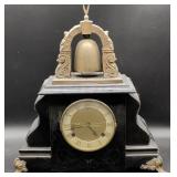 Black Mantel Clock with Bell and Ornate Arch