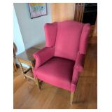 Red Upholstered Wingback Chair and Wooden Side Tab