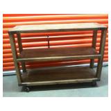 Wooden shelf on rollers