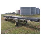 load of roof tin on JD header trailer