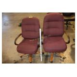 2 rolling office chairs