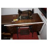 Antique Damascus trendle sewing machine in cabinet