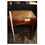 Vintage Singer sewing machine in cabinet