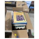 Box of machine knitting patterns and knitting