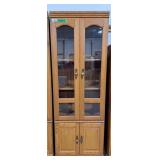 Elegant lighted glass front display cabinet