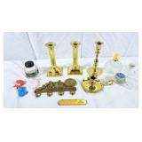 Brass candle holders, empty perfume bottles,