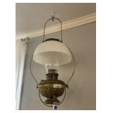 Large intricate brass hanging oil lamps with pale