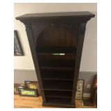 Large hallway bookshelf with beautiful trim