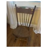 Vintage wooden rocking chair with basket weave