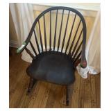 Wooden rocking chair with arm rests