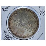 About Uncirculated 1965 Canada Dollar Coin