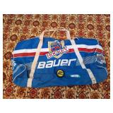 Vintage Bauer hockey duffel bag and hockey puck