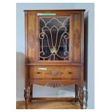 Elegant Krug Bros display cabinet on castors