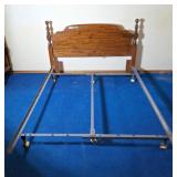 Queen sized bed frame with wooden headboard