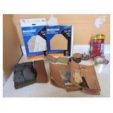 Assortment of sandpaper, steel tools and foil