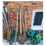Assortment of Garden Tools, hoses, water cans,
