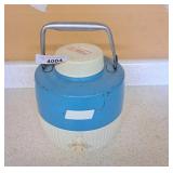 Coleman tin and plastic water cooler