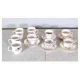5 tea cups with matching saucers and 4 mugs