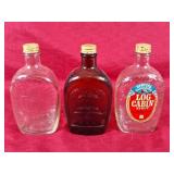 Vintage syrup bottles. Log cabin & liberty