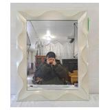 Bathroom mirror in plastic frame