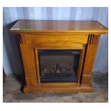 Wooden mantel with built in Dimplex Electric