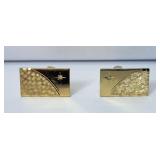 Pair of gold tone cuff links with tested diamonds