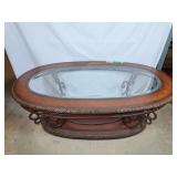 Oval glass top coffee table with steel frame,
