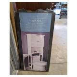 Hannah  behind the toilet cabinet open box