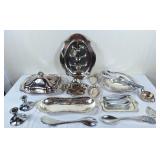 Assortment of silverplated serving trays, candle
