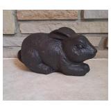 Black concrete rabbit statue