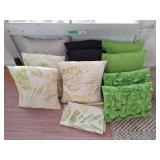 10 throw pillows and 1 matching small round side