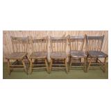 5 primitive wooden chairs. Great for extra