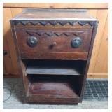 Rustic wooden nightstand with decorative carved
