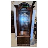 Curio cabinet features a mirrored back, interior