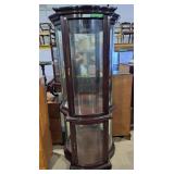 Mahogany half moon curio cabinet features curved