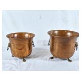 Pair of brass pots with paw feet