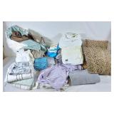 Box of linens, towels and bed sheets, bed skirts