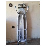 Metal ironing board with fabric iron